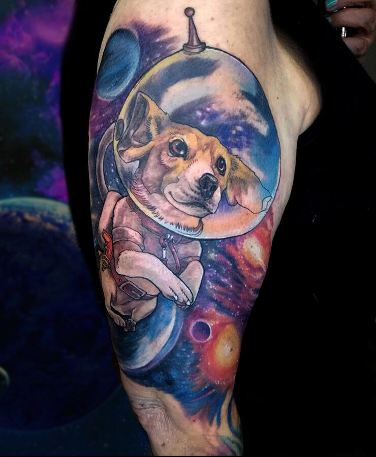 Space Dog Cosmic tattoo design with planets and a dog in a space suit. Full colour neo-traditional style. Tattoo by VampyCrafts in Cologne